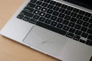 Damaged MacBook Air keyboard with missing keys and cracked trackpad - Mac repair Los Angeles