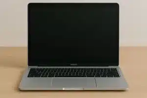 Macbook laptop on wooden desk at Macbook repair service in Los Angeles 90025