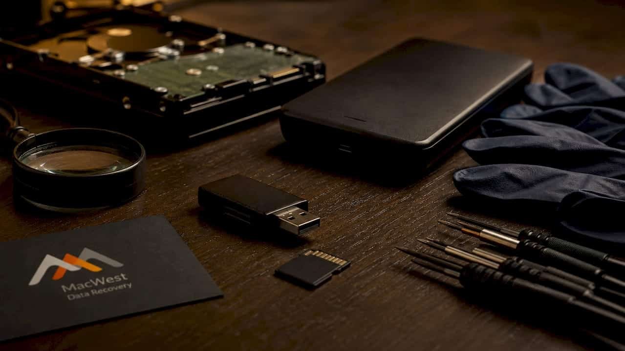 1781227699058_Technician-connecting-memory-card-to-reader Technician connecting memory card to reader