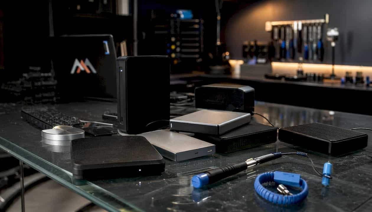 Close-up of external hard drives on repair bench