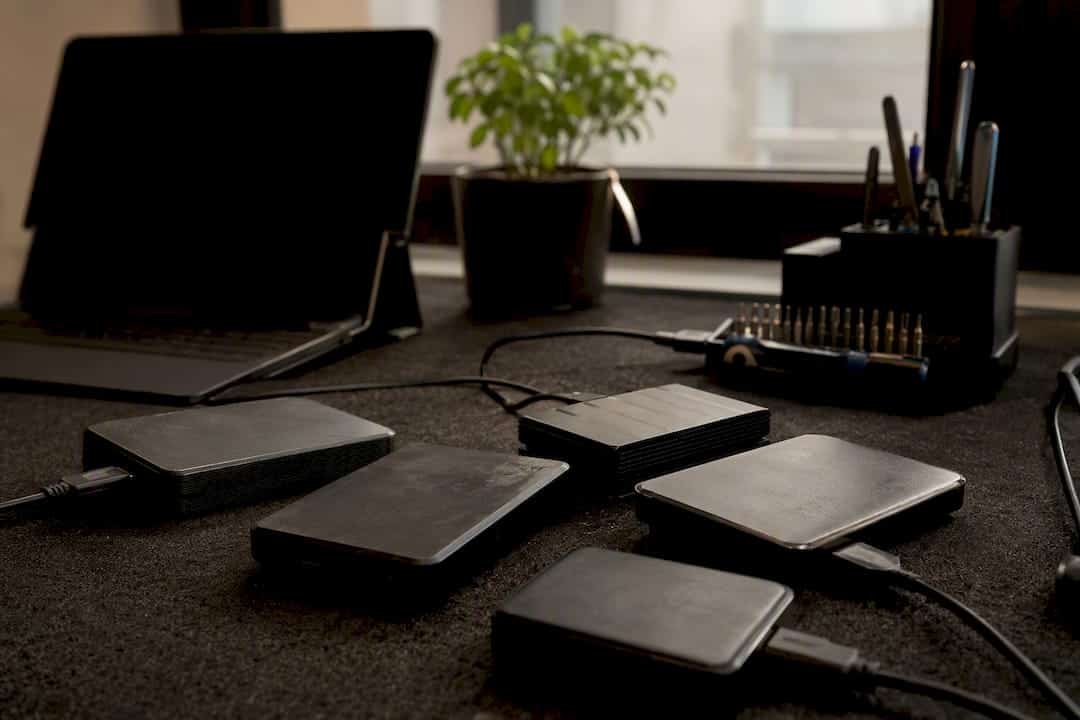 External hard drives and cables on repair bench