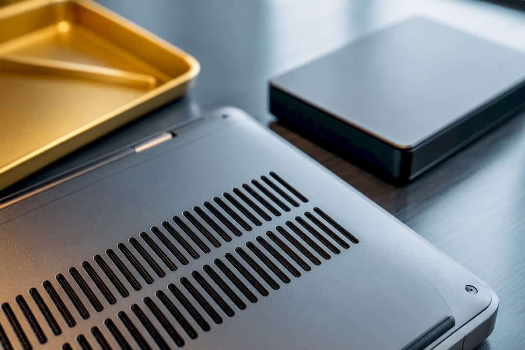 1789238134609_MacBook-vent-and-external-drive-diagnostic-close-up MacBook vent and external drive diagnostic close-up