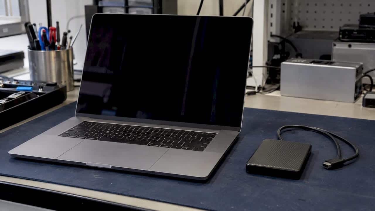 1792035252468_MacBook-and-external-drive-on-recovery-bench MacBook and external drive on recovery bench