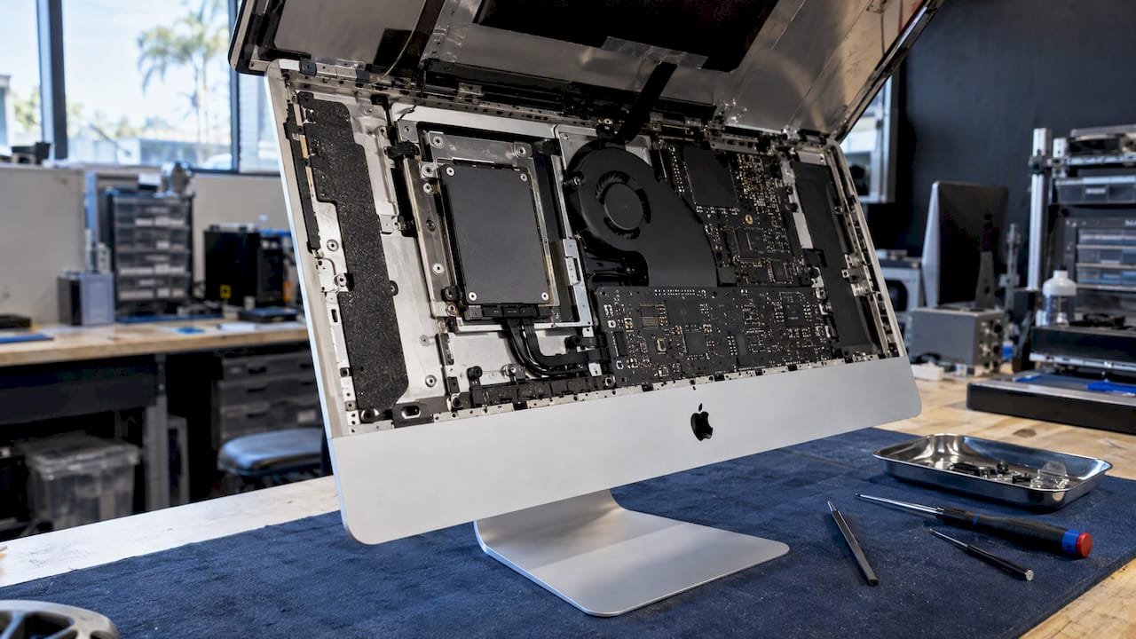 Opened iMac showing internal SSD upgrade work